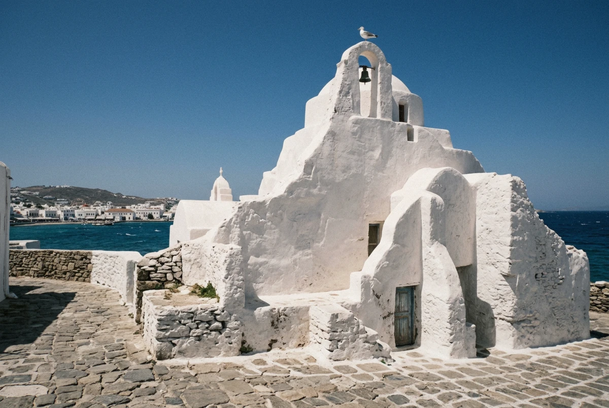 Whitewashed Paraportiani church, one of four stops on a Mykonos flying dress photoshoot